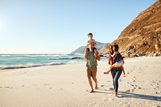 A family walking along a beach