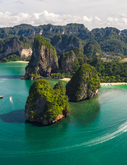 Limestone karst islands rising from turquoise Maldivian water